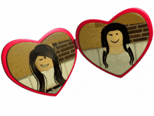 two heart shaped mirrors with a woman 's reflection on them