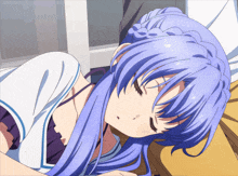 a girl with purple hair is sleeping on a bed