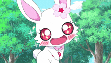 a white rabbit with a pink flower on its head is standing in the woods