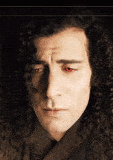 a close up of a man with red eyes
