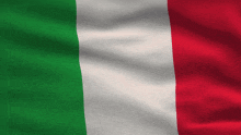 a green white and red flag is being blown in the wind