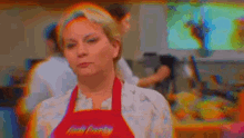 a woman wearing an apron that says cook 's country on it