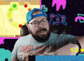 a man with a beard wearing a shirt that says omg !