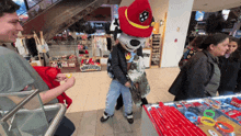 a man in a mascot costume is standing in front of a store called homeertips