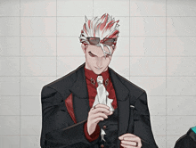 a man with red and white hair wearing a suit and tie