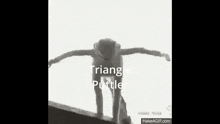 a black and white photo of a triangle putter ball being thrown .