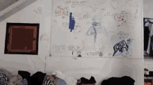 a messy room with graffiti on the wall including one that says ' nasty '