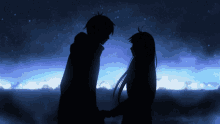 a silhouette of a man and woman holding hands