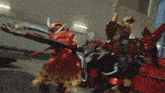 a couple of robots fighting each other in a room .