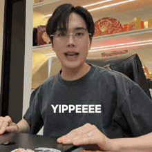 a man wearing a t-shirt that says yippeee on it