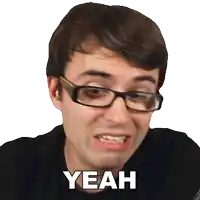 a man wearing glasses is making a funny face and the word yeah is above him