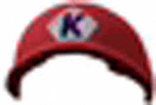 a red baseball cap with the letter k on it is on a white background .