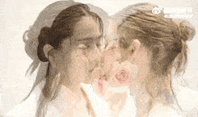a double exposure of a woman kissing another woman 's face