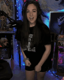 a woman wearing headphones and a shirt that says " just my way to here "