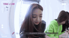 a video of yuna 's cam shows a woman in a green hoodie