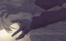 a close up of a person 's hands with a purple background