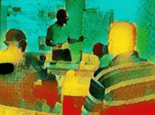 a man is giving a presentation to a group of people in a room .