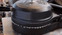 a close up of a black pot with the words made in animatica on the bottom