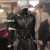 a man in a suit and tie is standing in front of a sign that says vigge.ai