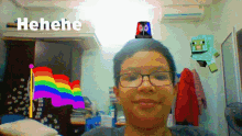 a boy with glasses has a rainbow flag on his head and the word henehe is above him