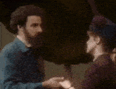 a man and a woman are holding hands in a blurry picture