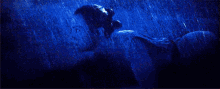 a painting of a man and a woman kissing in the rain