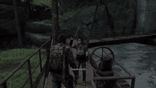a man and a woman standing on a bridge talking