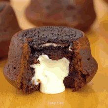 a chocolate cake with a bite taken out of it and easy plus written on the bottom right