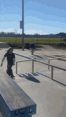 a person riding a skateboard down a set of stairs with a sticker that says r7 on it