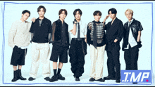a group of young men standing next to each other with the word tmp on the bottom right