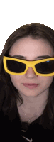 a woman wearing a pair of yellow sunglasses