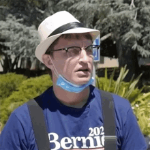 a man wearing a hat and a shirt that says bernie 202
