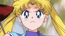 a girl with blonde hair and blue eyes is holding a flag and making an angry face .