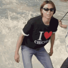 a woman wearing sunglasses and a t-shirt that says i love chicago