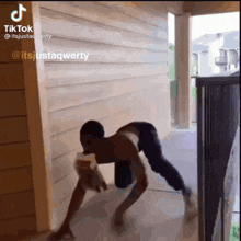 a tiktok video of a person doing push ups on the floor