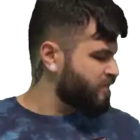 a man with a beard and a tattoo on his neck is wearing a blue shirt