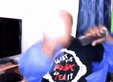 a man is wearing a shirt that says what the f * ck is tea