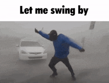 a man in a blue jacket is dancing in front of a white car with the words let me swing by below him
