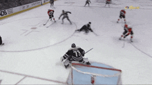 a hockey game is being played in front of a banner that says american master