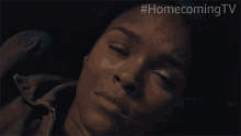 a close up of a woman 's face with the hashtag #homecomingtv visible