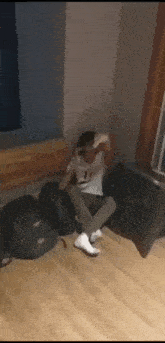 Guy Sitting On Floor Middle Finger GIF