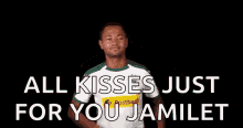 a man is giving a kiss with his hands in the air and the words `` all kisses just for you jamilet '' .