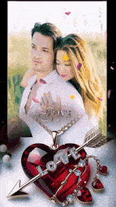 a picture of a man and woman with an arrow through a heart with the word love on it