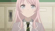 a girl with pink hair and blue eyes is wearing a tie and a suit .