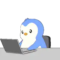 a penguin is sitting at a desk using a laptop computer