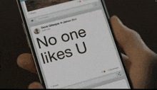 a person holding a cell phone that says no one likes u on the screen