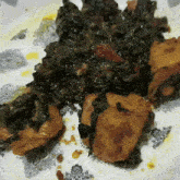 a close up of a plate of food with a floral design on it
