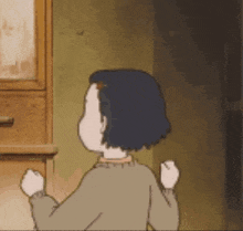 a cartoon girl is standing in front of a wooden cabinet with her arms in the air .