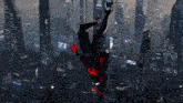 a person is flying over a city with a sign that says ea
