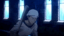 a man in a white hat is holding a baseball bat in front of a window .